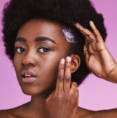 Black woman, hair portrait and conditioner for afro, haircare and ethnic texture on pink studio background. African model, haircare cream and lotion product for scalp maintenance, skincare and beauty Black woman, hair portrait and conditioner for afro, haircare and ethnic texture on pink studio background. African model, haircare cream and lotion product for scalp maintenance, skincare and beauty